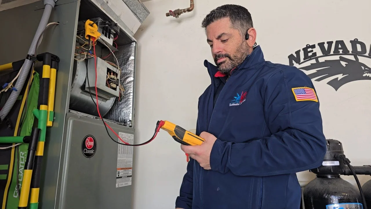 Technician testing an HVAC system with a multimeter.