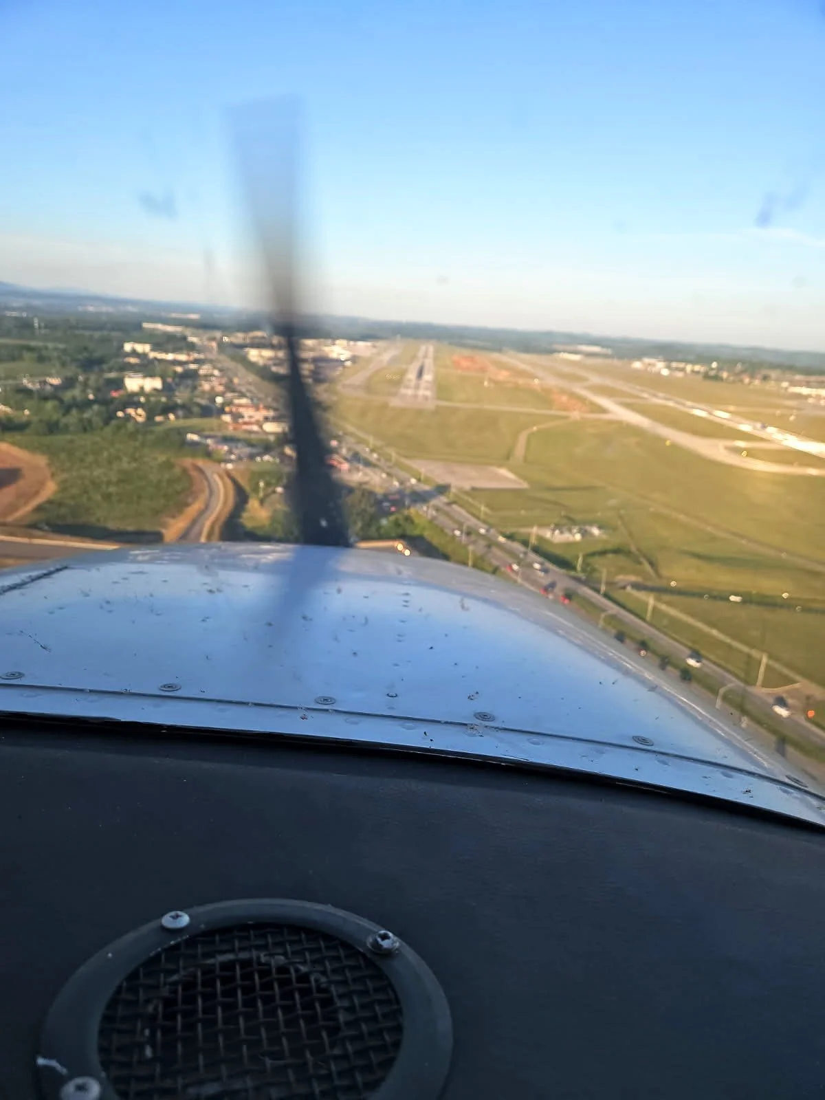 View from an airplane cockpit showing the runway on final approach to one of the runways at McGhee Tyson  Airport.