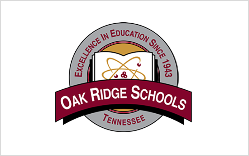 Logo for Oak Ridge Schools, Tennessee, featuring a book with an atomic symbol and text indicating excellence in education since 1943.