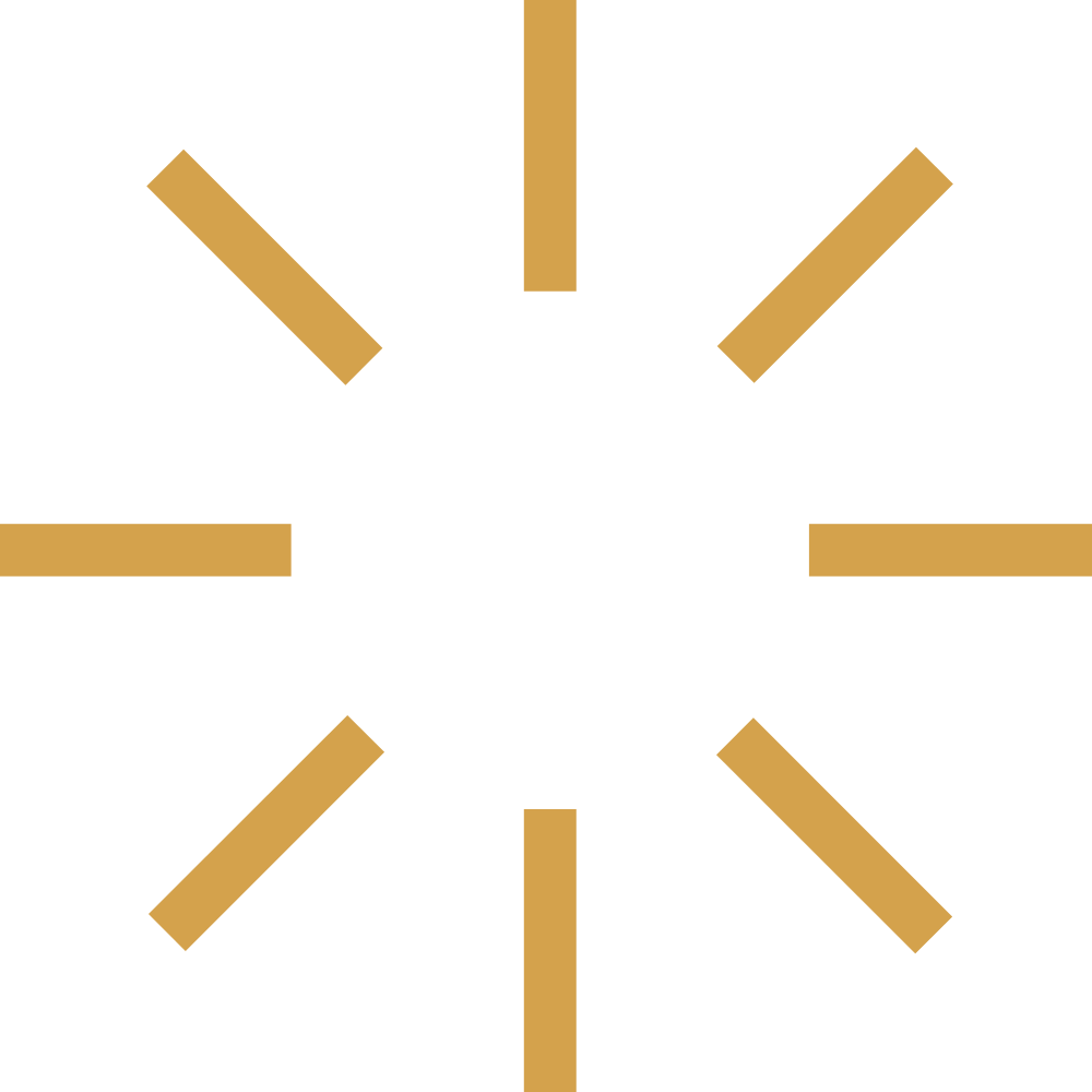 A black clock face with gold hour markers and no hands.