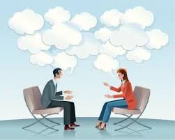 A man and woman sitting across from each other in chairs, engaging in a conversation with clouds of thought above their heads.