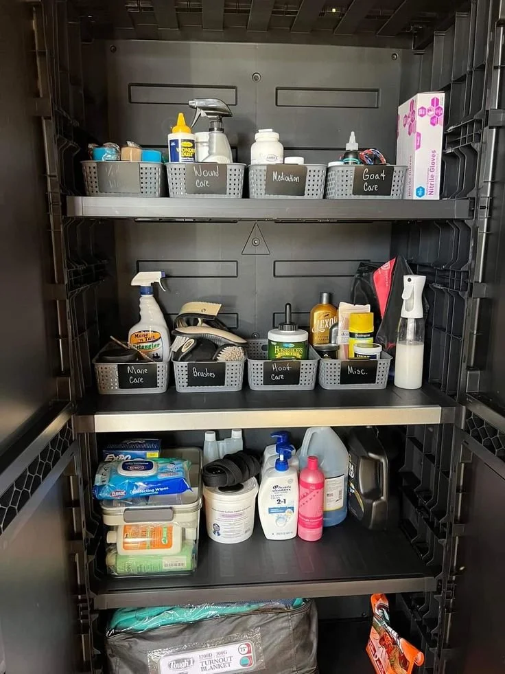 Organized cabinet with various cleaning and care supplies, labeled bins for wound care, meditation, coat care, and more.