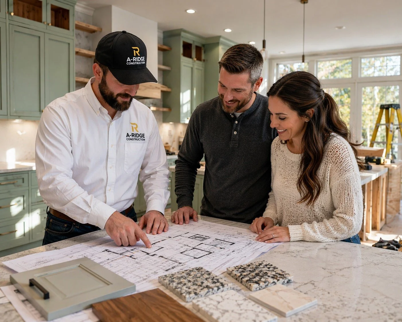 A-Ridge Construction contractor reviewing remodeling plans with homeowners during kitchen renovation in The Woodlands TX