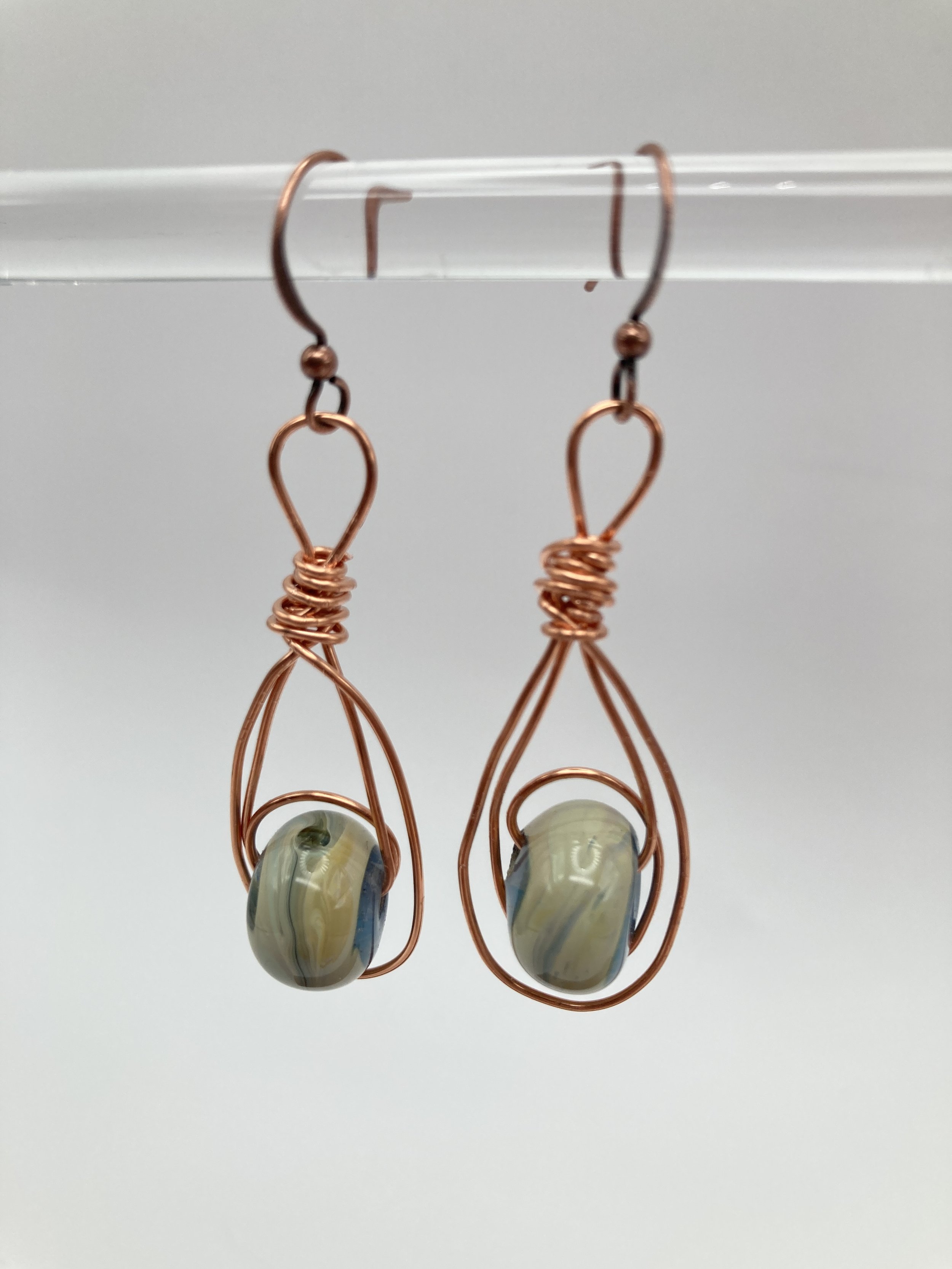 green multi colored glass beads w copper wire surrounding