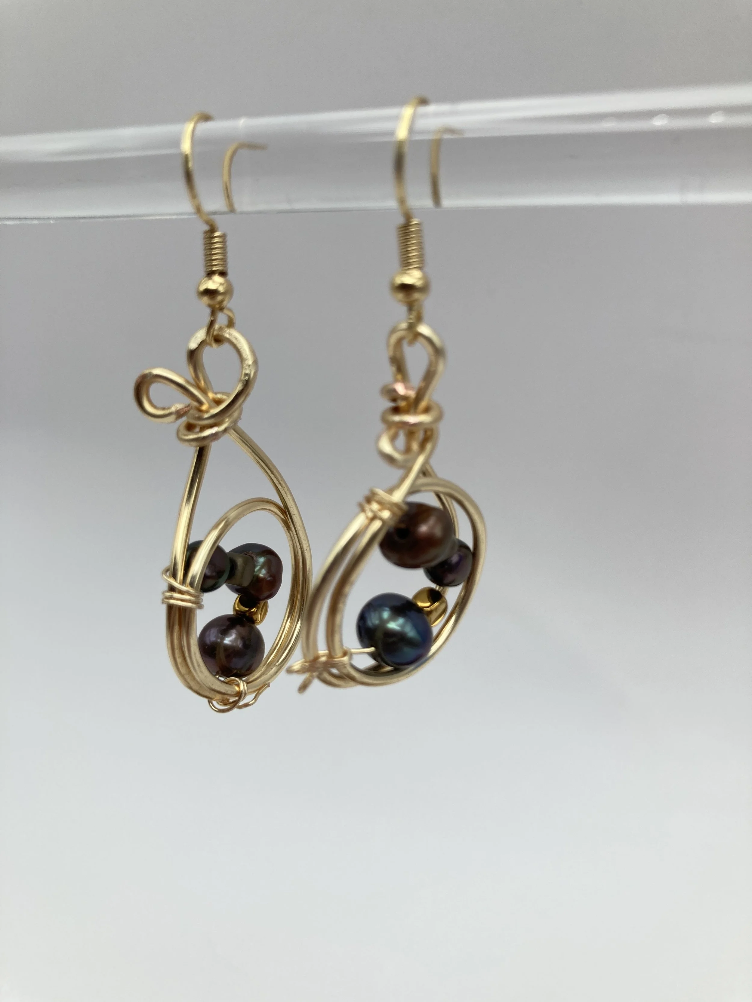 double gold wire circle with cultured pearls inside