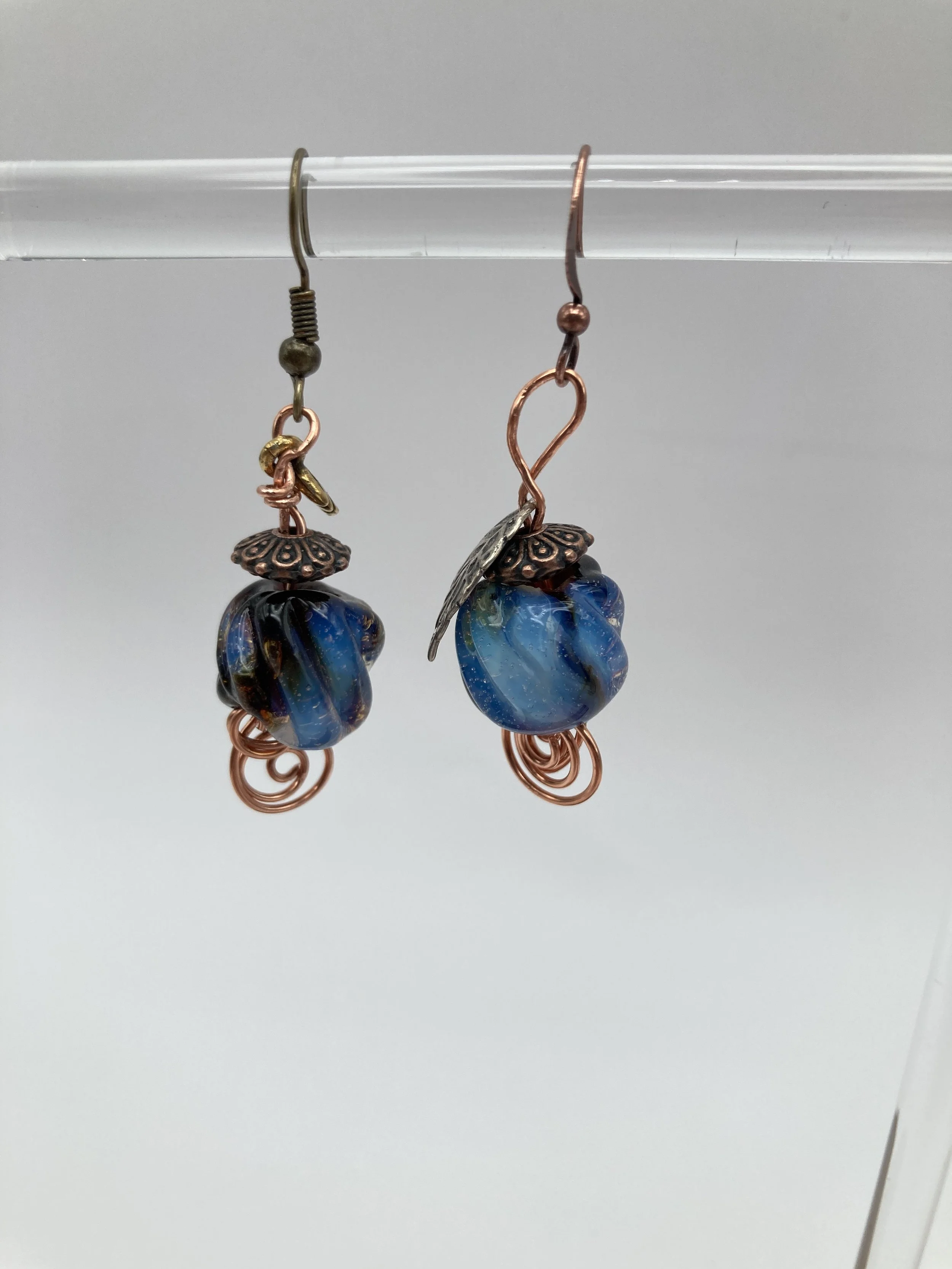 surrounding copper w blue glass beads inside