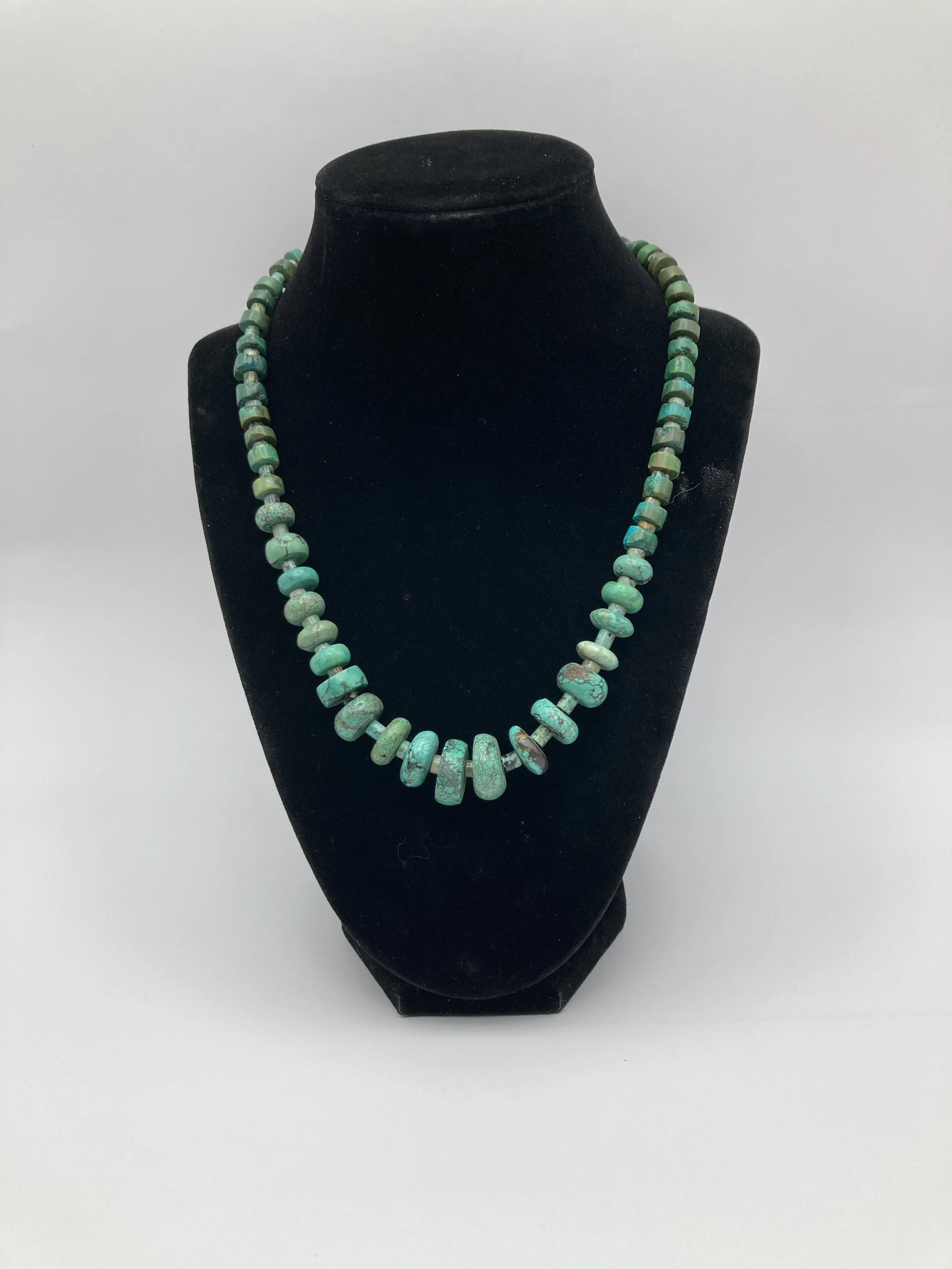 graduated turquoise w large brass clasp