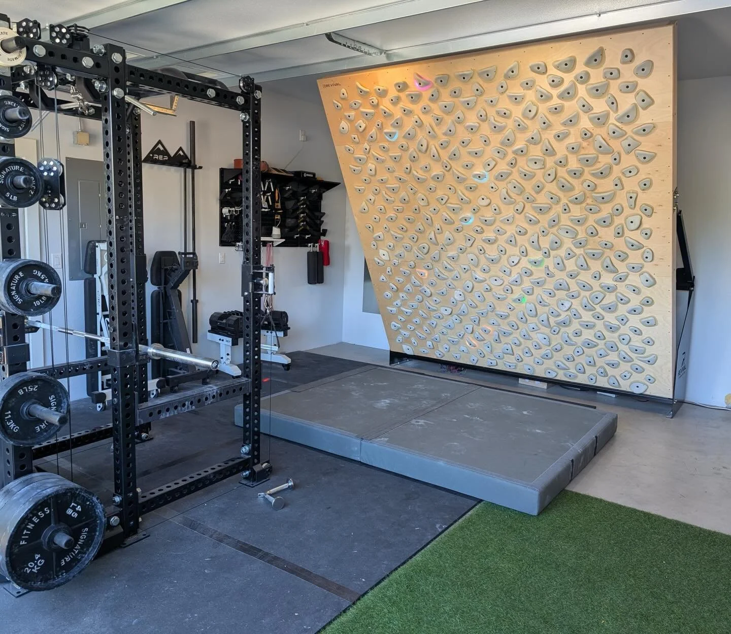 Car or training center&hellip; which would you rather put in your garage?
⁣⁣
📸 10x10 Home Wall fitted with a #kilterboard Full Ride and 2x 4&rsquo;x6&rsquo; drag mats.
⁣⁣
#homewall #adjustablewall #homeclimbingwall #boardclimbing