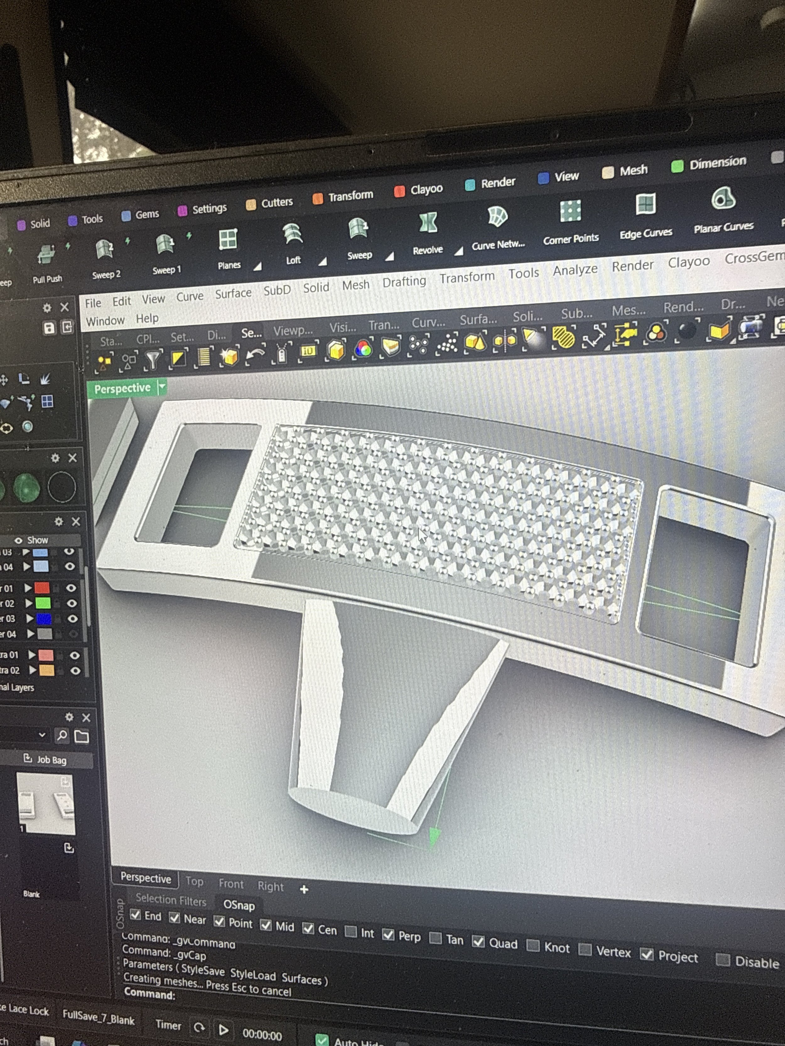 Computer screen showing 3D modeling software with a model of a rectangular object featuring a textured surface and supporting structure.