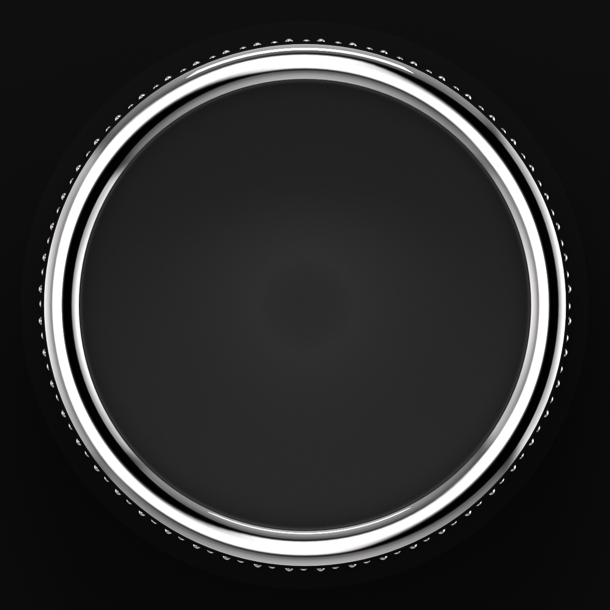 Top view of a black and silver rotary dial with a textured edge.