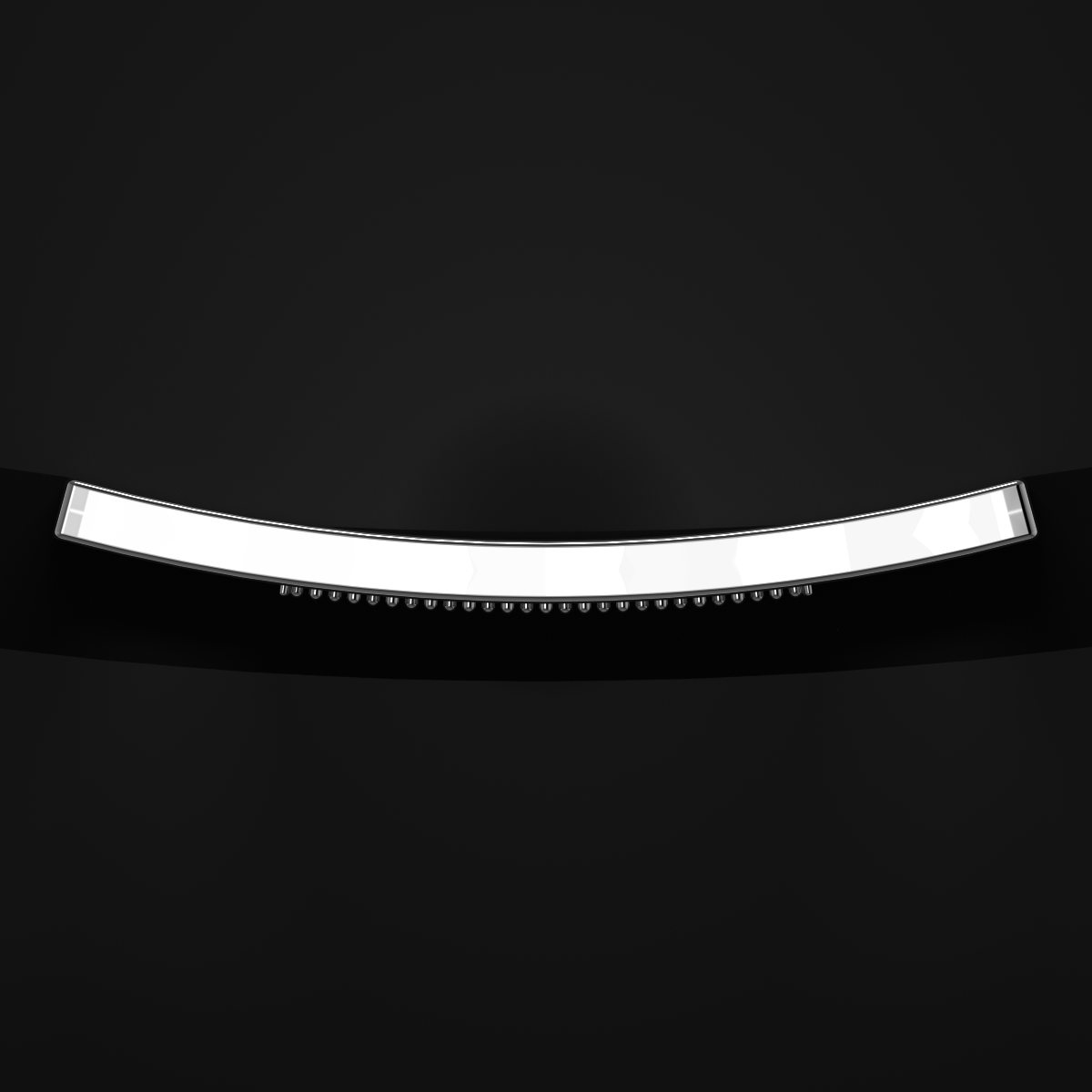 Close-up of a sleek, modern black surface with a curved, illuminated white trim.