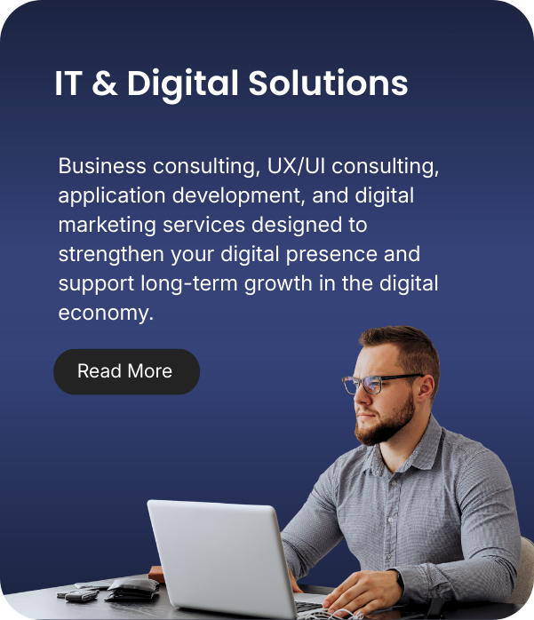 Business professional working on laptop at desk promoting IT and digital solutions, with text about consulting services and a 'Read More' button.