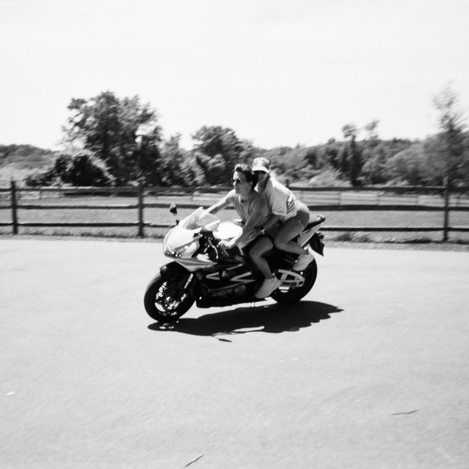 The husband and wife (Sam and Alexandra Swansen) owners of Twin Fin Coffee, in Aguadilla, PR. Couple is riding a vintage Honda motorcycle together.