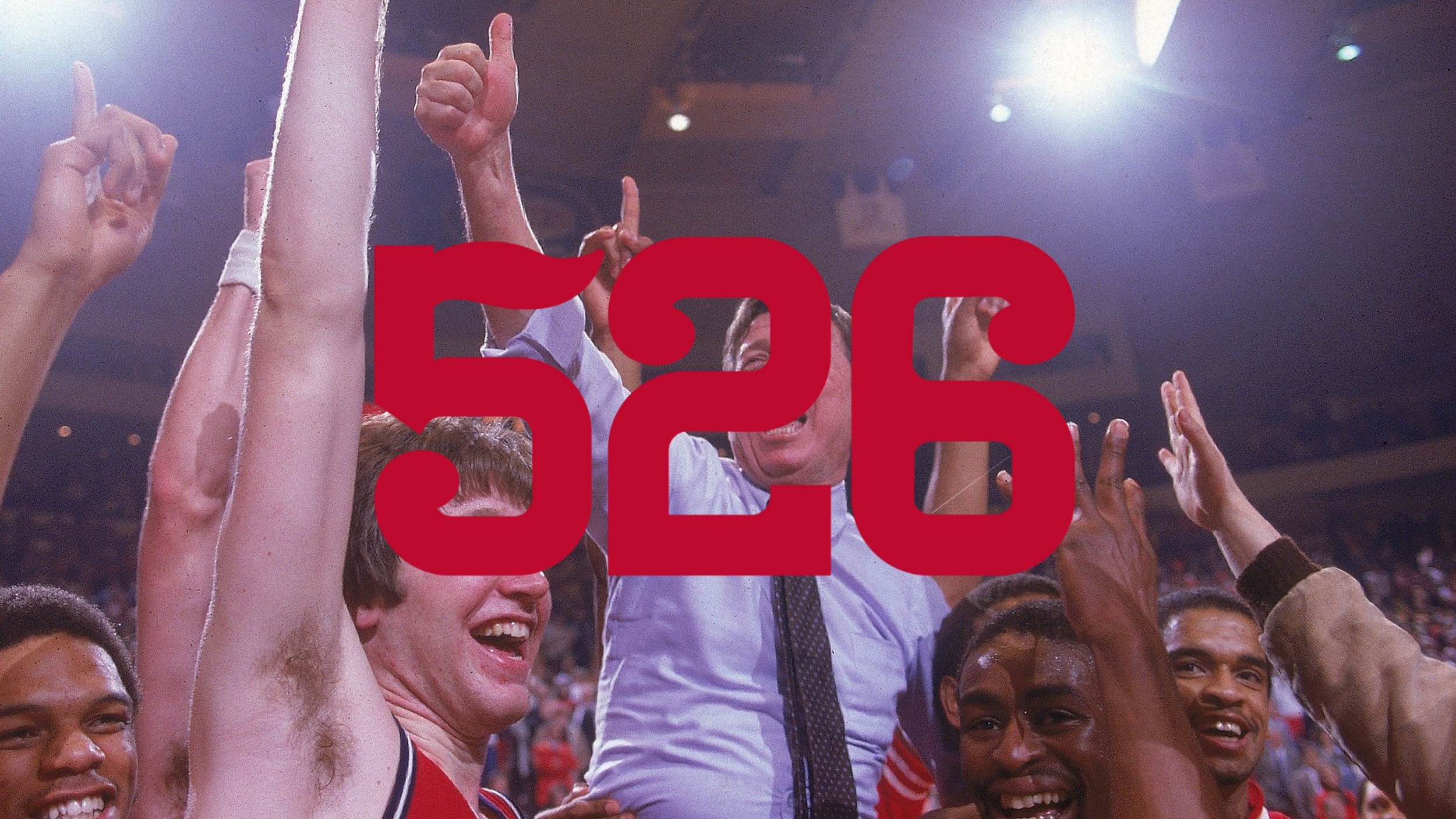 A group of ecstatic people celebrating a victory, with some raising their hands, in a celebratory crowd, overlayed with red text reading '52-30'.