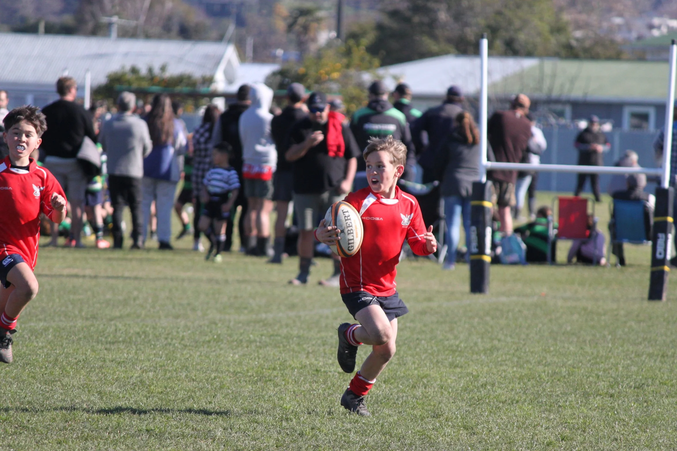 Hawkes Bay festival - young boy running with rugby ball