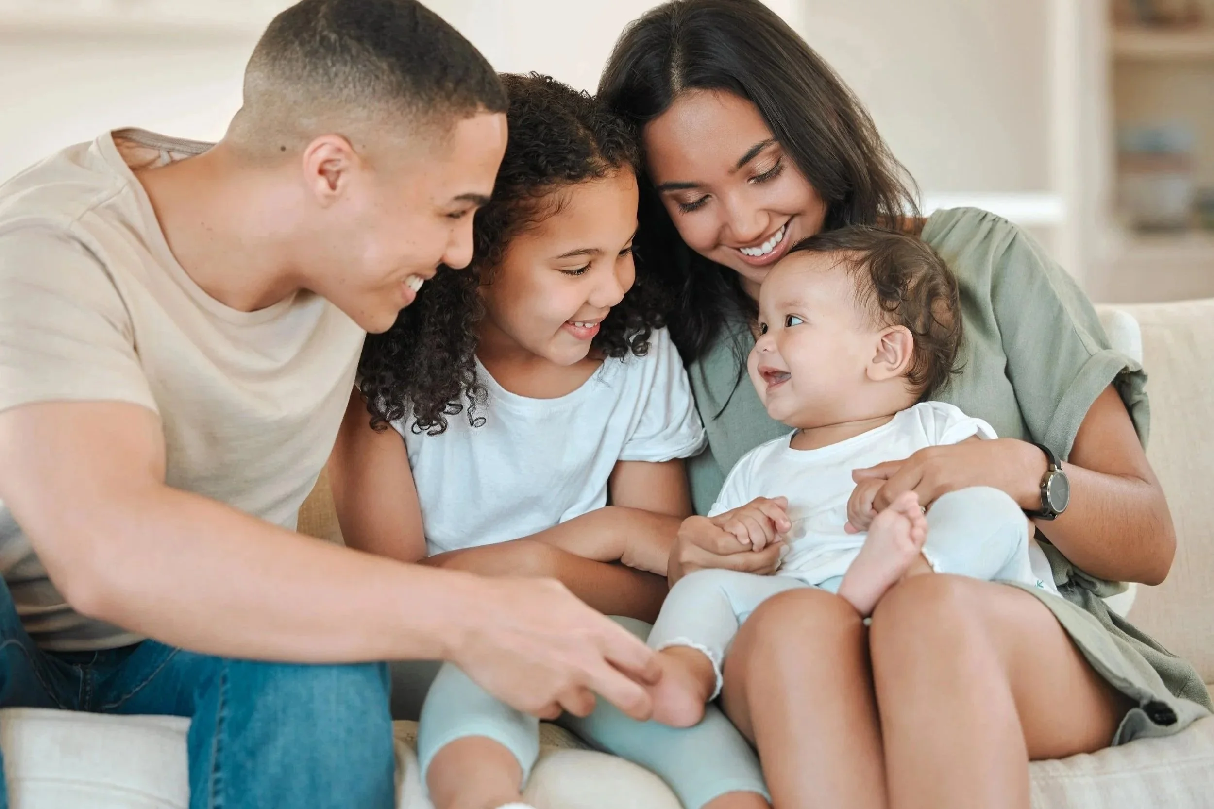 Family sitting on a couch
