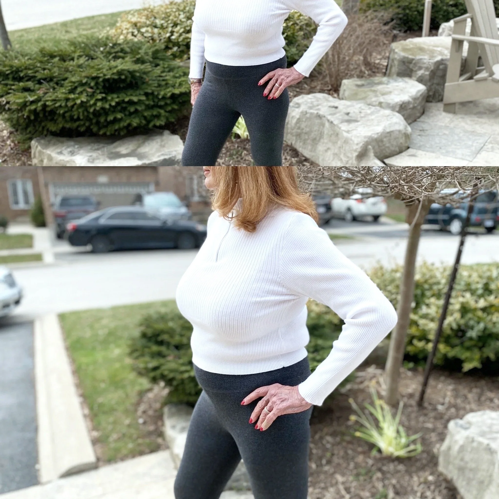 A woman standing outdoors in front of bushes and rocks, wearing a white long-sleeve top and dark gray pants, with her hand on her hip and her face partially visible.