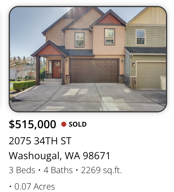 Front view of a two-story house with a brown garage door, pink and yellow exterior siding, and a small front porch; part of a neighborhood with other similar homes.