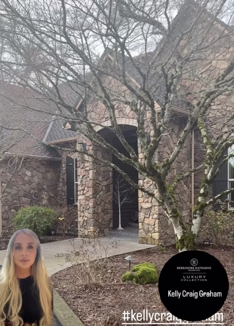 A stone house with a large front yard located in Washougal Washington. leafless trees, and  Kelly Craig Graham in the lower left corner.  Sold by Kelly Craig Graham.