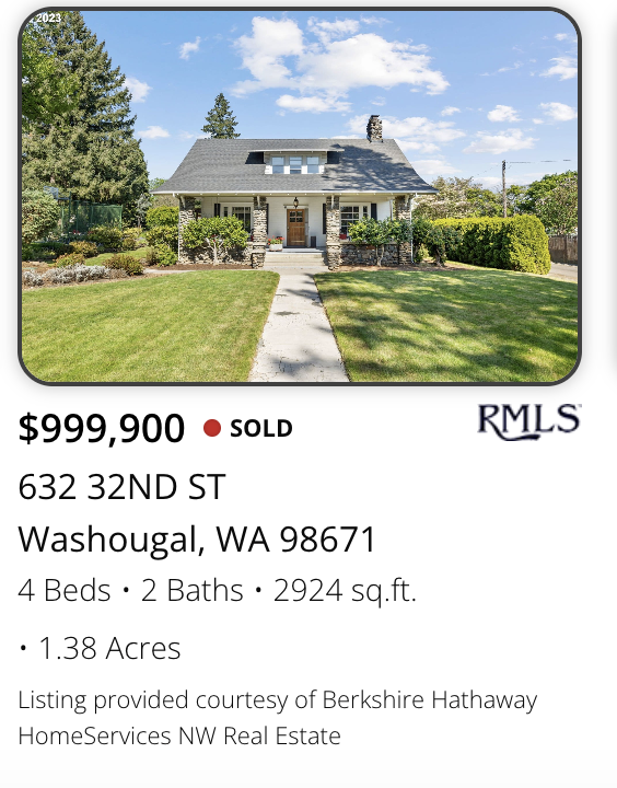 Front view of a historic Washougal home with a well-maintained lawn, stone porch, and chimney, under a blue sky with clouds, marketed and sold by realtor Kelly Craig Graham