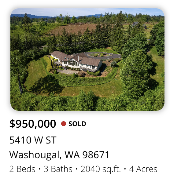 A large house on luxury in town estate, surrounded by trees and greenery, located on a 4-acre property sold by realtor Kelly Craig Graham Washougal, Washington.