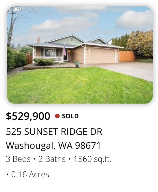 Single-story house with a front lawn, garage, porch, and an American flag, located on Sunset Ridge Drive in Washougal, Washington.