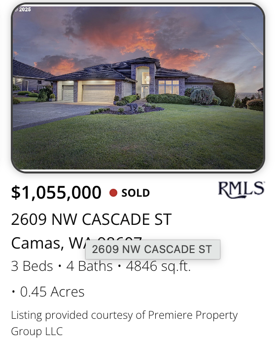 A Camas view home sold by realtor Kelly Craig Graham with Front view of a modern house with a multi-car garage, stone and siding exterior, surrounded by a well-maintained lawn at sunset.