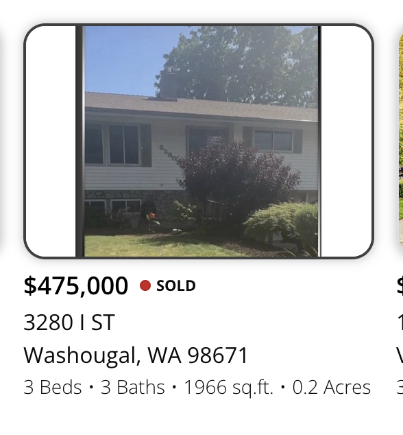 Photo of a house with white siding, surrounding shrubs, and a large tree, located at 3280 1st street in Washougal, Washington, with listing details including 3 bedrooms, 3 bathrooms, 1966 square feet, on 0.2 acres, sold for $475,000.