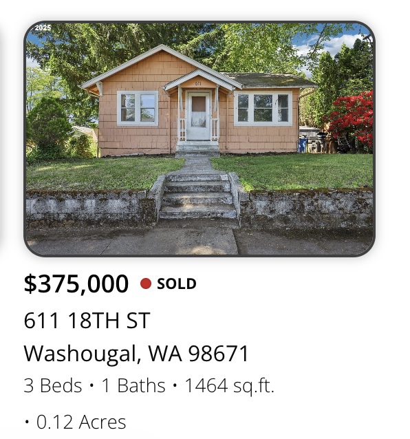 Photo of a single-story house with a front lawn, steps leading to the front door, surrounded by trees and greenery in Washougal, Washington.