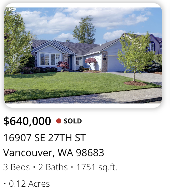 Front view of a blue house with a manicured lawn and trees, sold for $640,000, located at 16907 SE 27th St, Vancouver, WA.