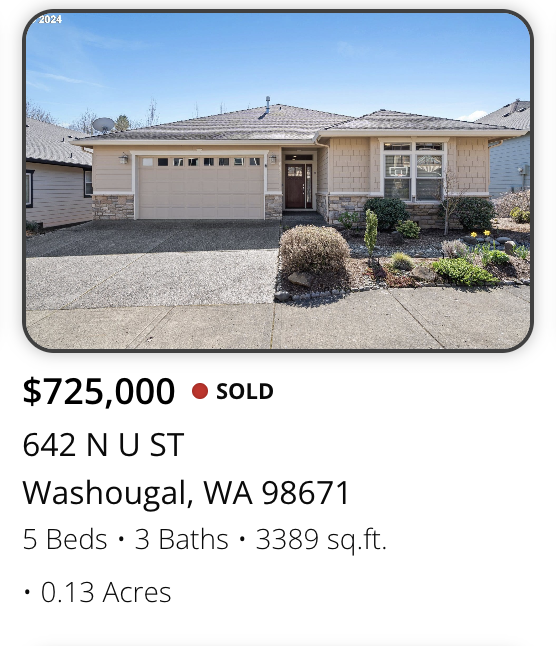 Single-story house with attached garage, landscaped front yard, and a concrete driveway in Washougal, Washington.