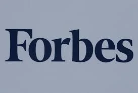 Forbes logo in dark blue on a light gray background.
