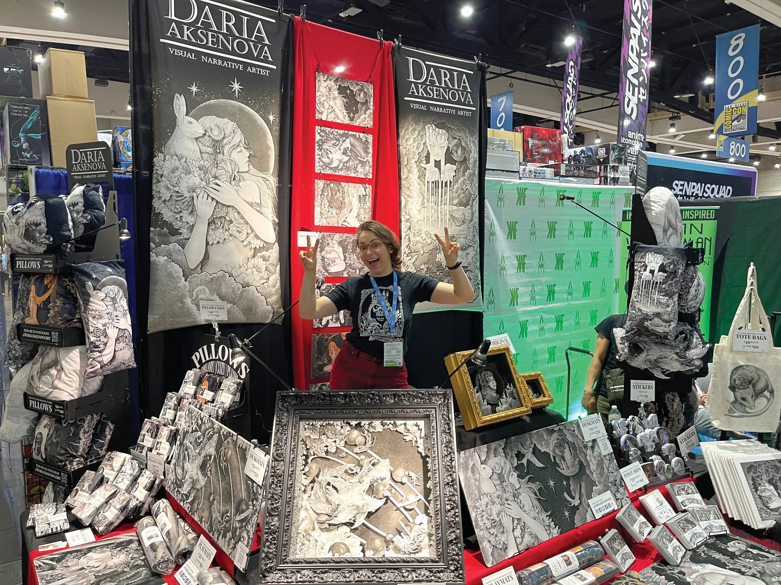 Daria Aksenova, our sponsored artist from 2023, in her booth.