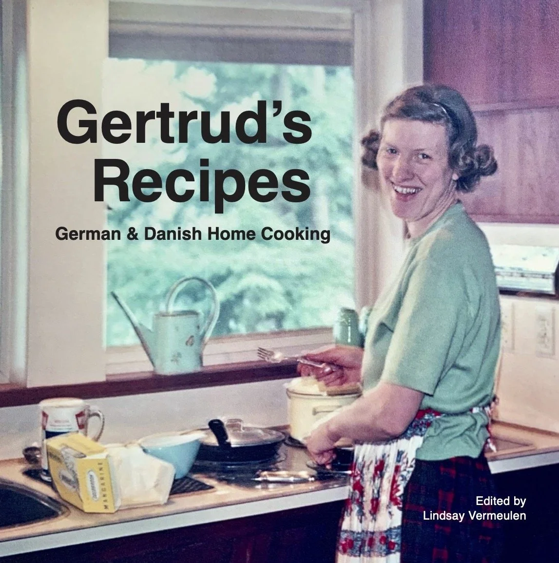 Older white woman in her kitchen cooking