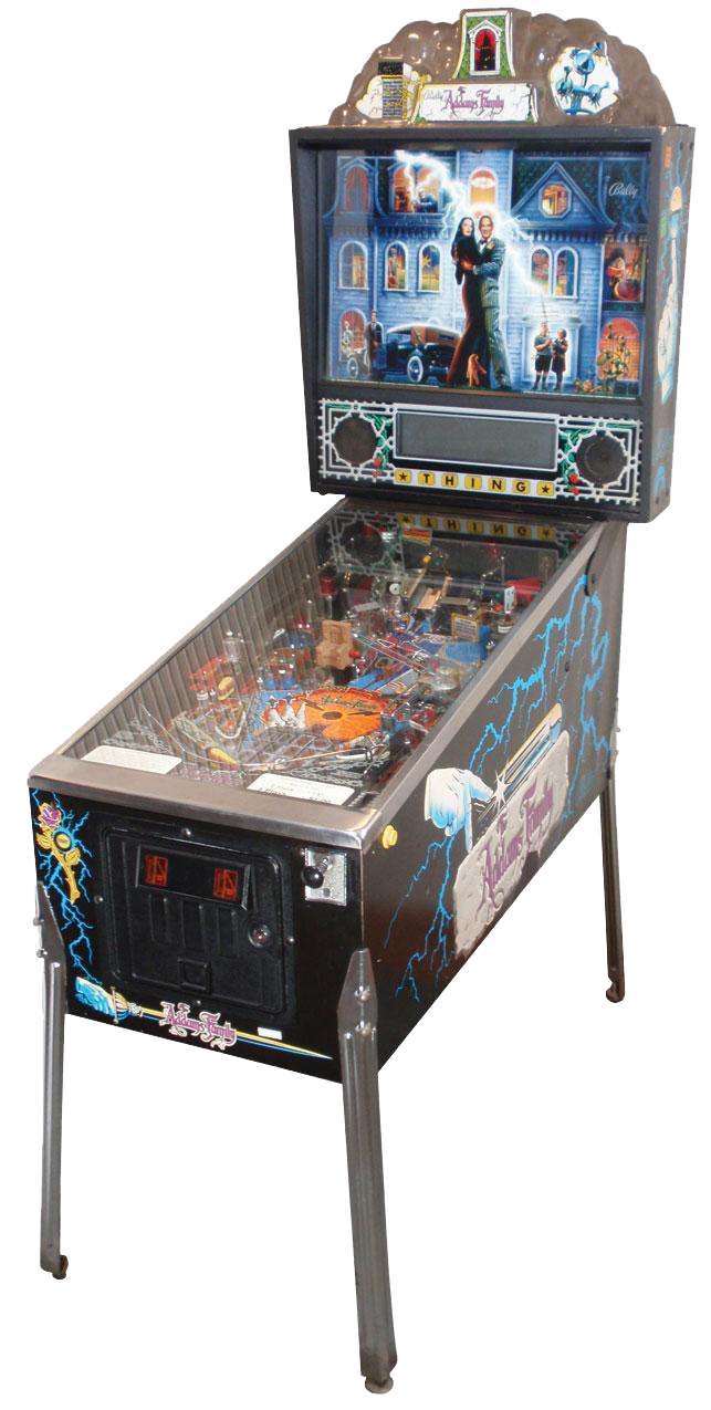 A Adams Family pinball machine featuring a haunted house scene on the backboard, with a couple embracing in front of it, and illuminated artwork, all standing on four metal legs.