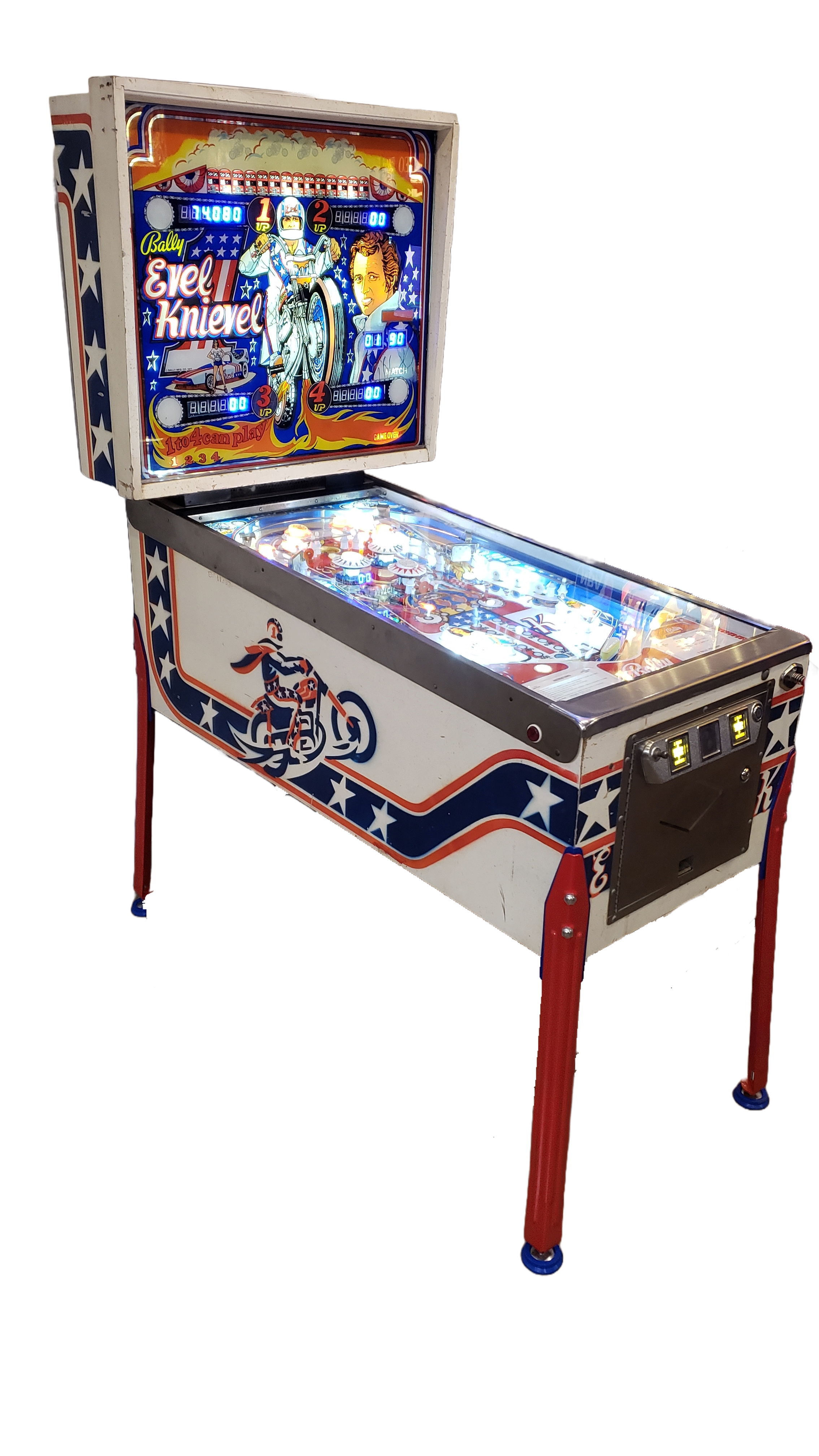 A vintage Evel Knievel pinball machine with patriotic red, white, and blue stars and stripes, featuring a motorcycle and a woman on the backglass artwork.