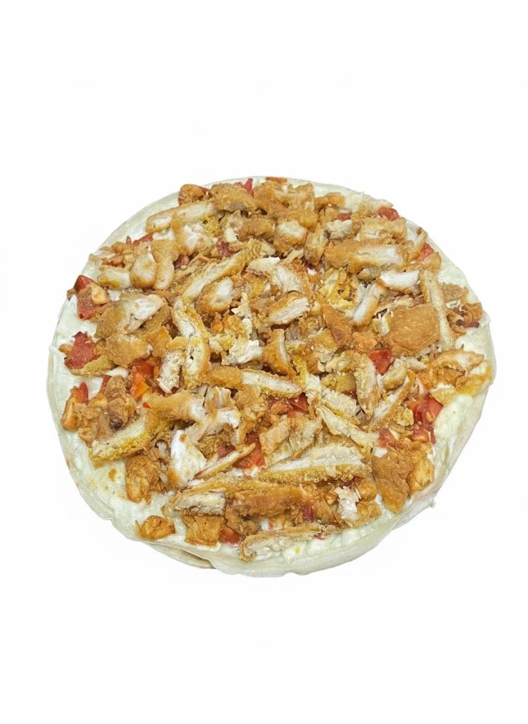 A small pizza topped with grilled chicken pieces, tomatoes, and cheese on a white background.