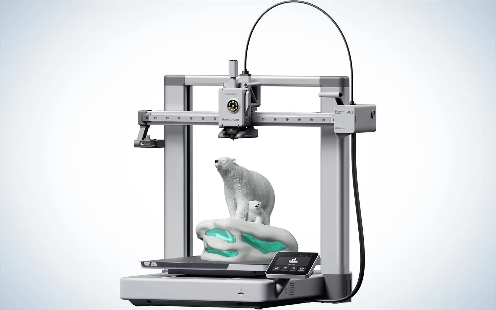 A 3D printer printing a model of a polar bear and a smaller bear, with the Bambu Lab A1 printer's head attached to a metal frame and a control panel in the foreground.