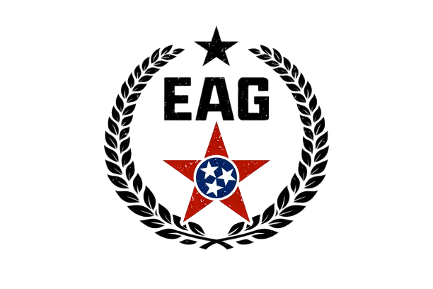 EAG emblem featuring a red star with a white circle containing blue and white stars, surrounded by a laurel wreath and a black background.