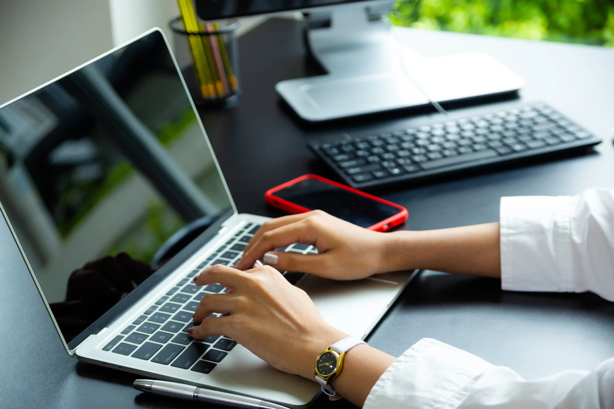 female-hand-typing-keyboard-laptop.jpg