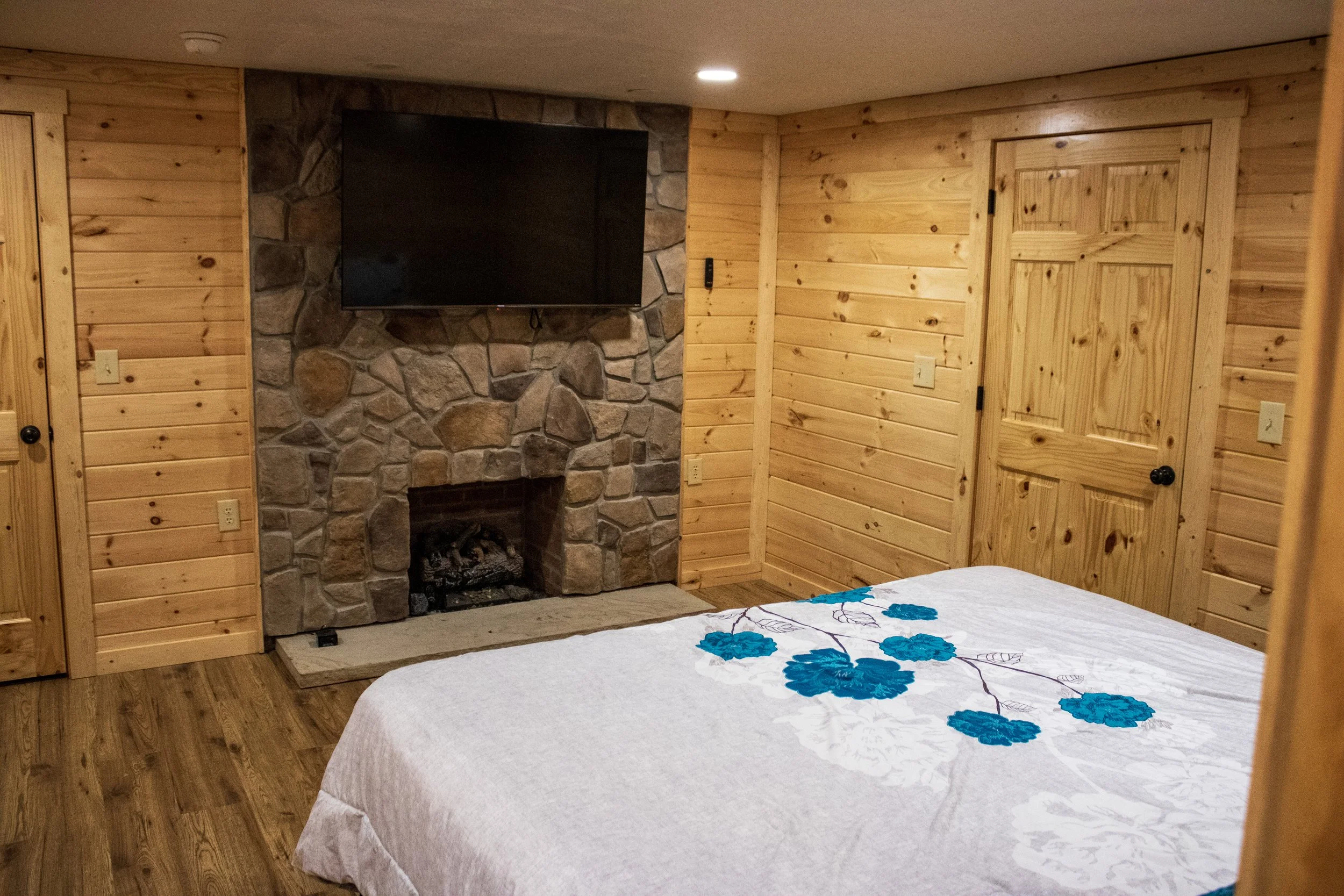 4 Bed cabin Master Bedroom Fireplace.JPG