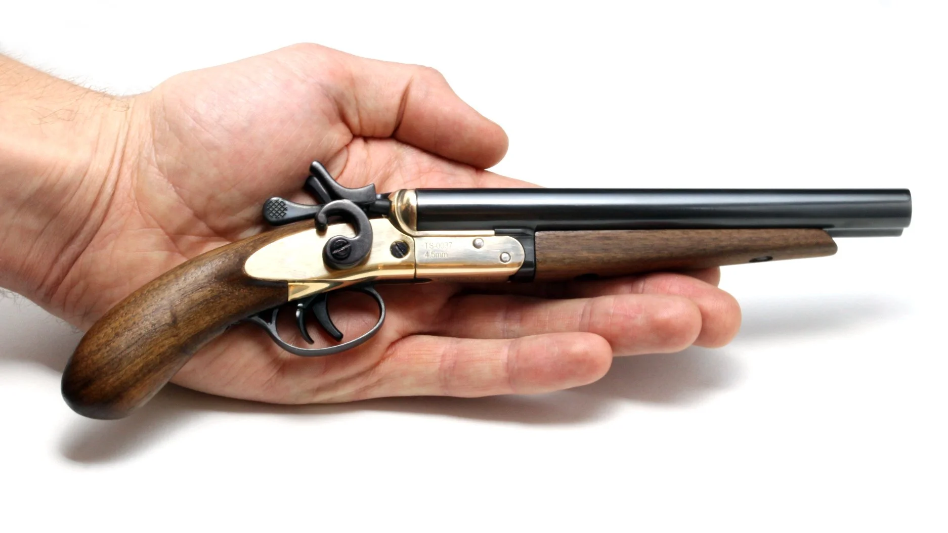 TOMBSTONE miniature firearm in hand.jpg