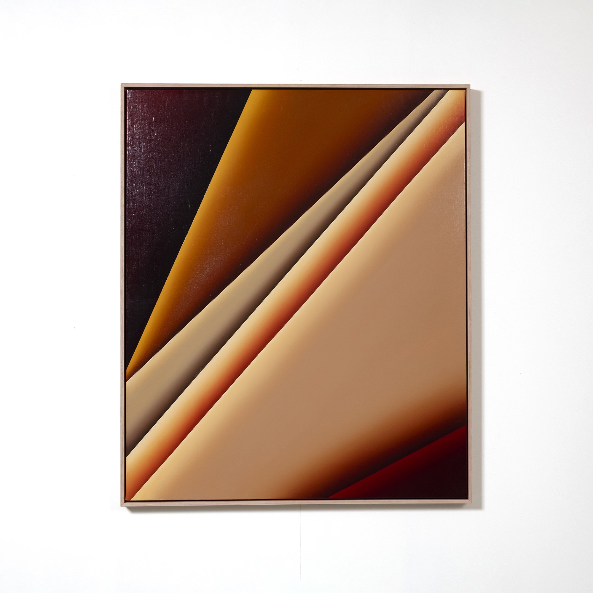 Abstract artwork with diagonal layers in shades of brown, orange, and black, framed in wood, mounted on a white wall.