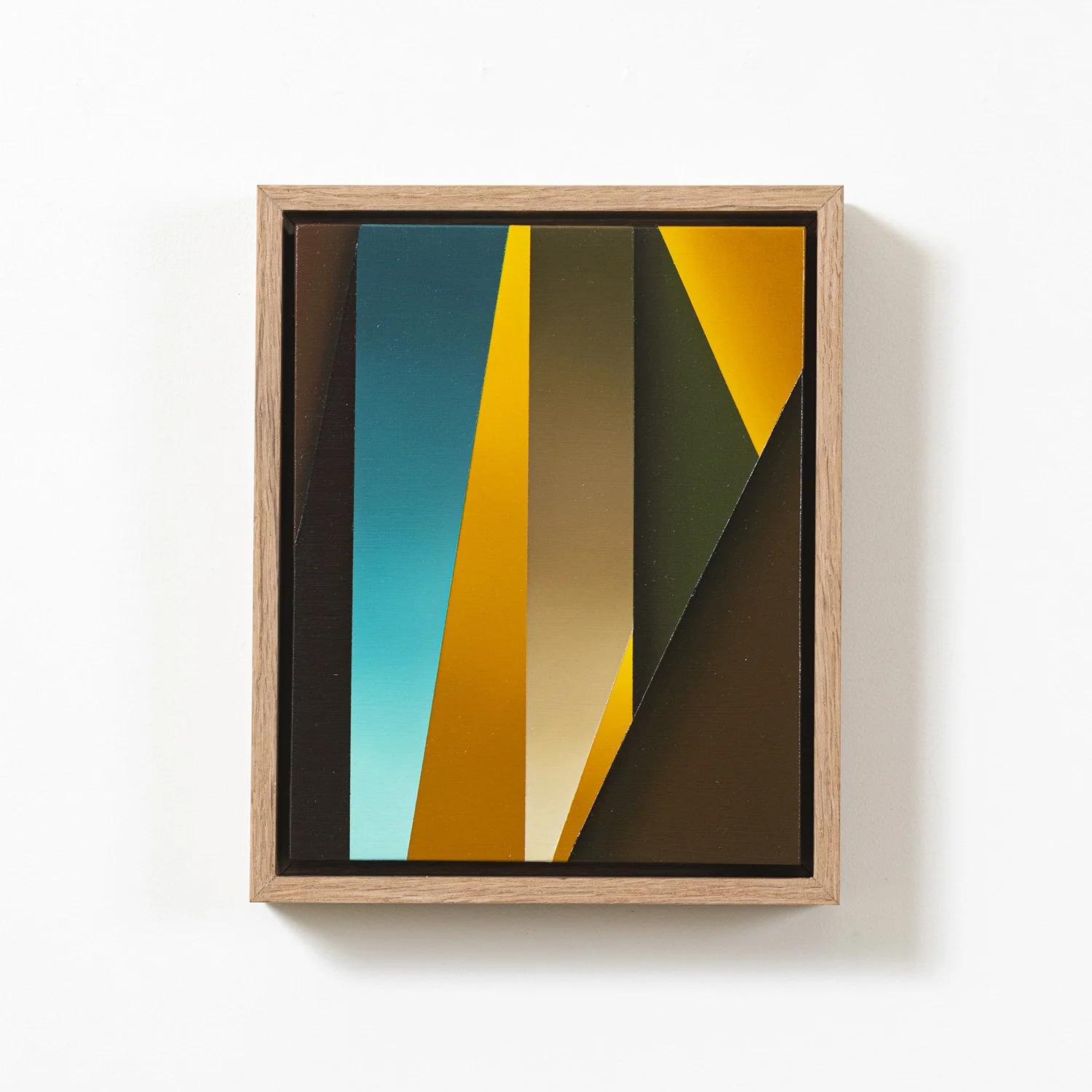Abstract geometric artwork with vertical and diagonal colorful shapes in a wooden frame on a white wall.