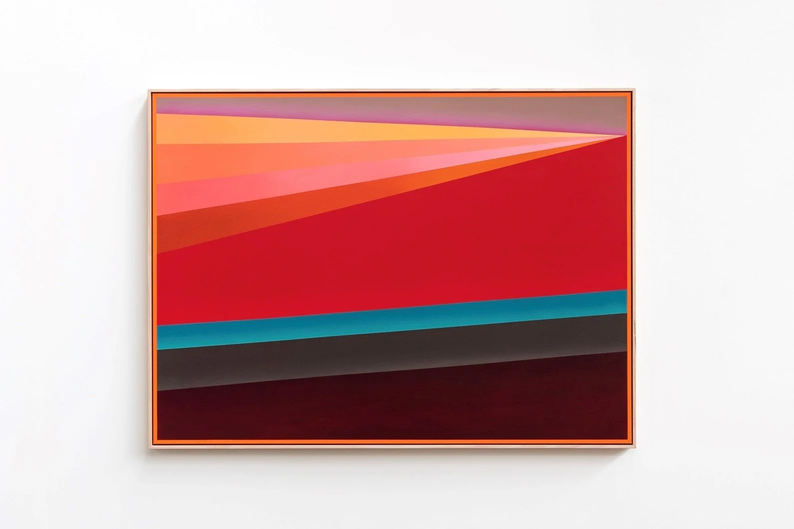 Abstract colorful geometric painting with diagonal color bands in pink, red, blue, gray, and black, framed in orange, displayed on a white wall.