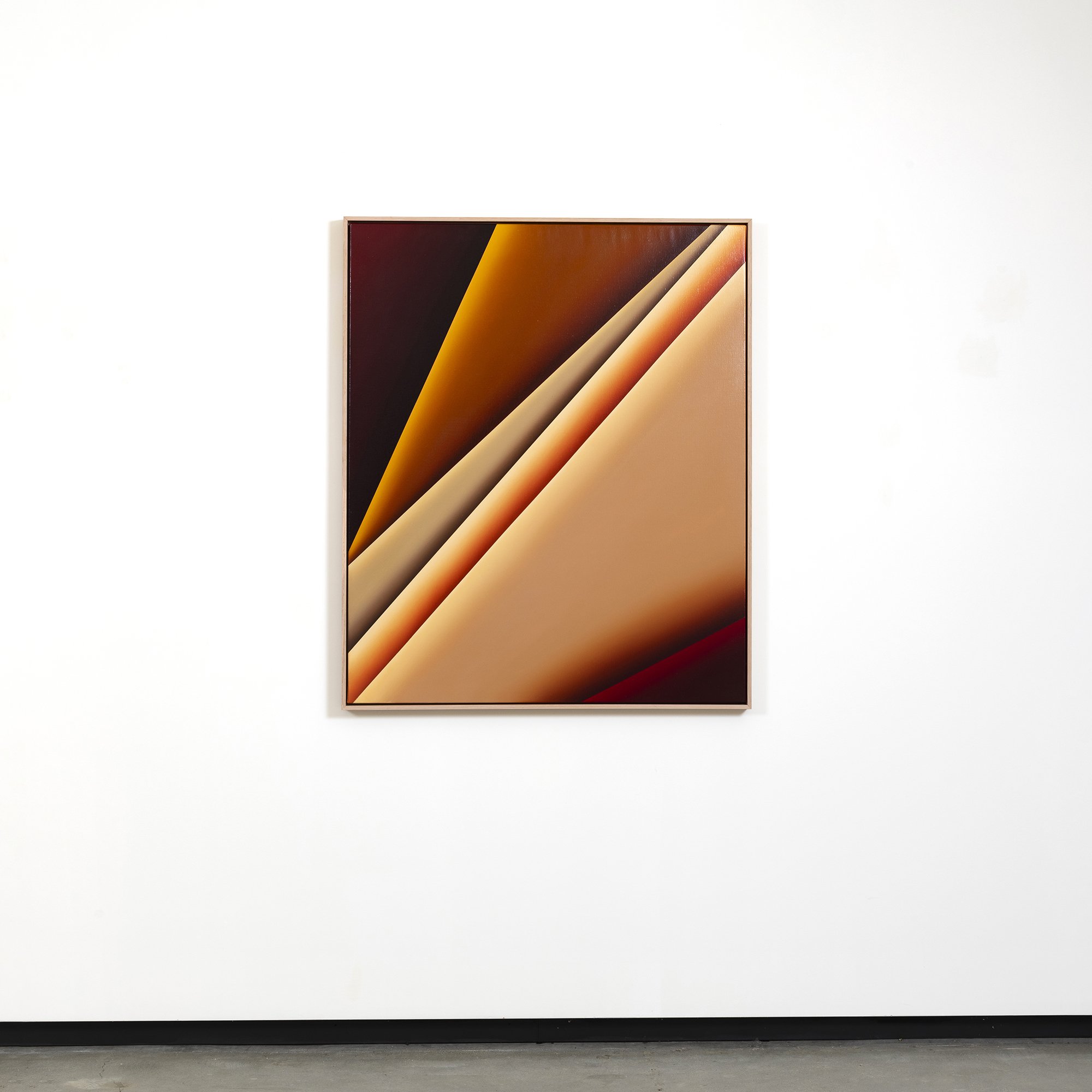 Abstract art painting with warm tones hanging on a white gallery wall.