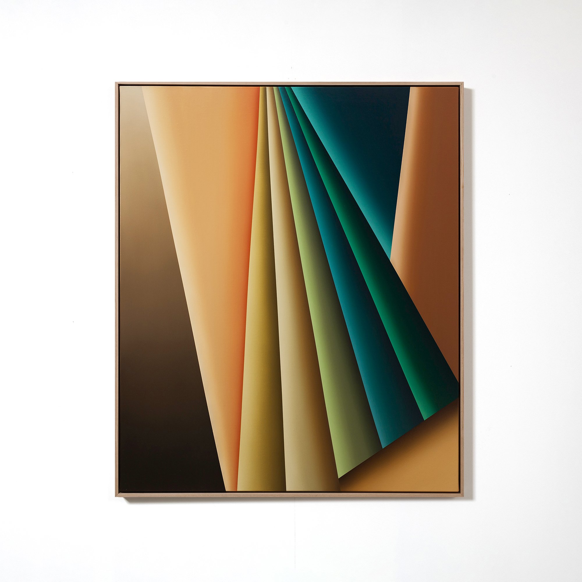 Close-up of an abstract colorful framed artwork on a white wall, featuring geometric shapes and gradient colors including orange, green, blue, and beige.