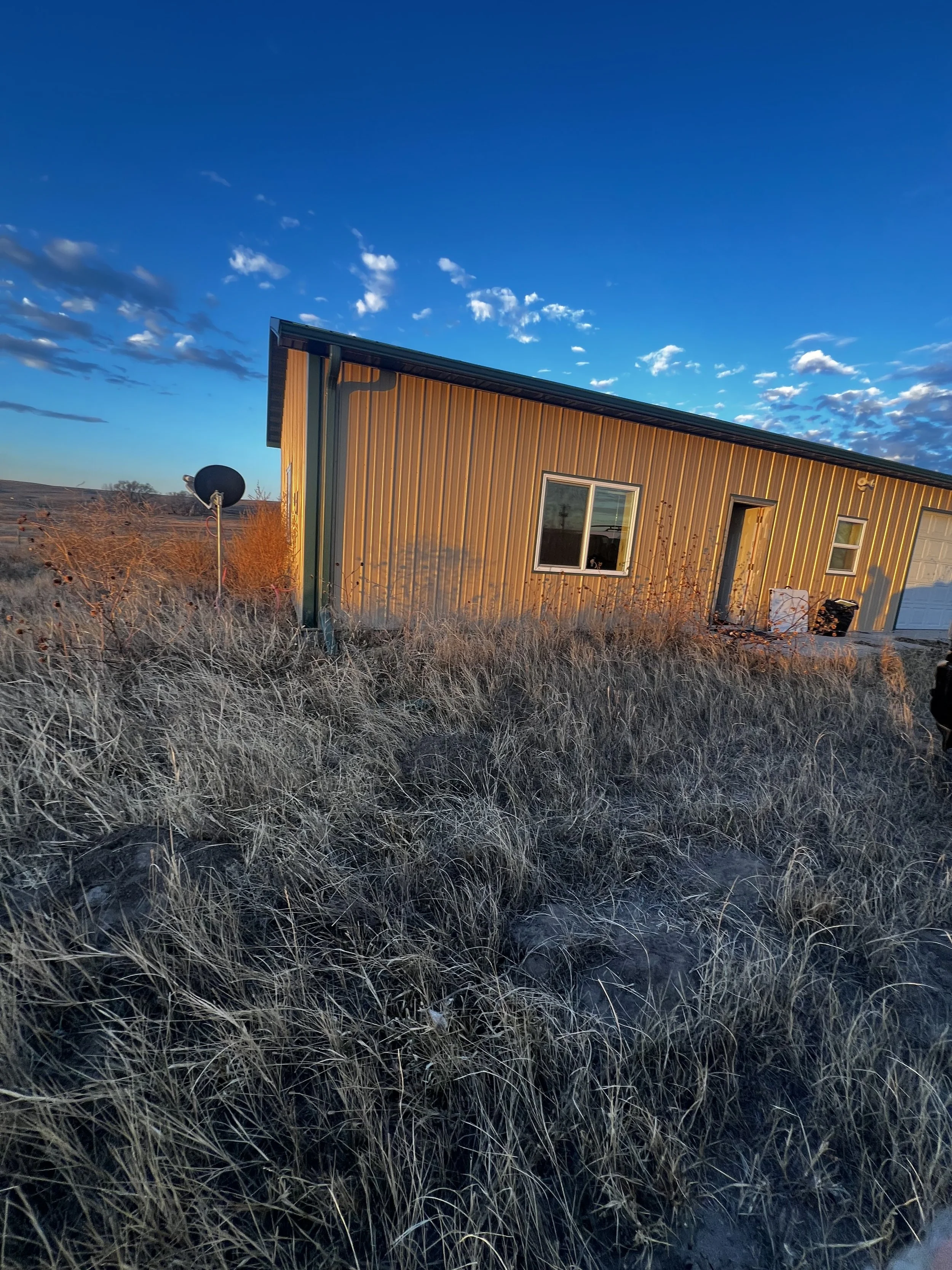 Hunting Cabin built in central nebraska with steel siding and a window and a door, outdoors in a deer habitat, hunting, insulated