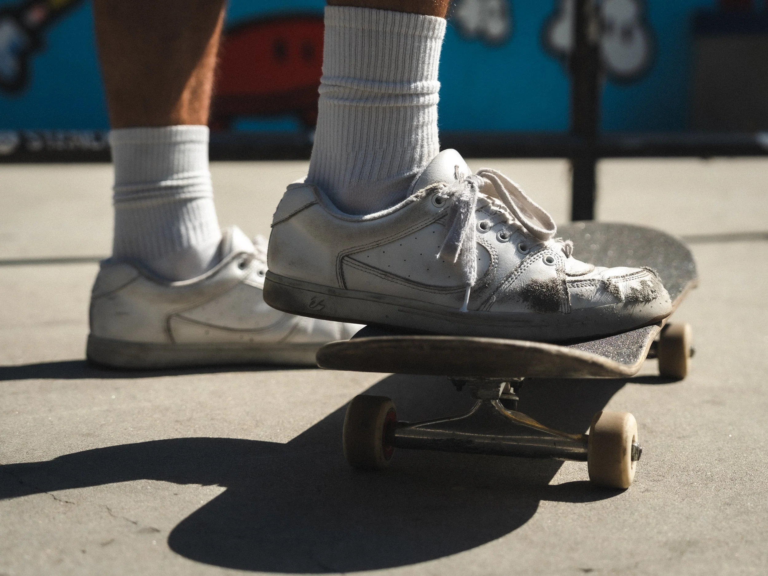Close-up of a skate shoe on the board at the West LA Courthouse skatepark, Los Angeles skate photography by Osy Ikhile