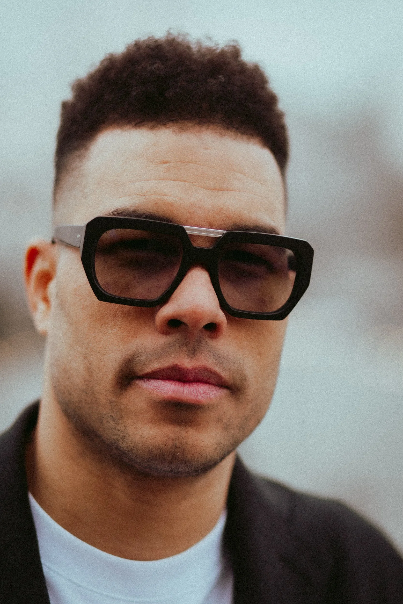 Portrait of a man in tinted Kirk & Kirk sunglasses